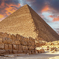 Pyramids of Giza, Cairo, Egypt at sunset. Built by the Pharaohs as a tomb and passage to the afterlife, where they believed they would be Gods.